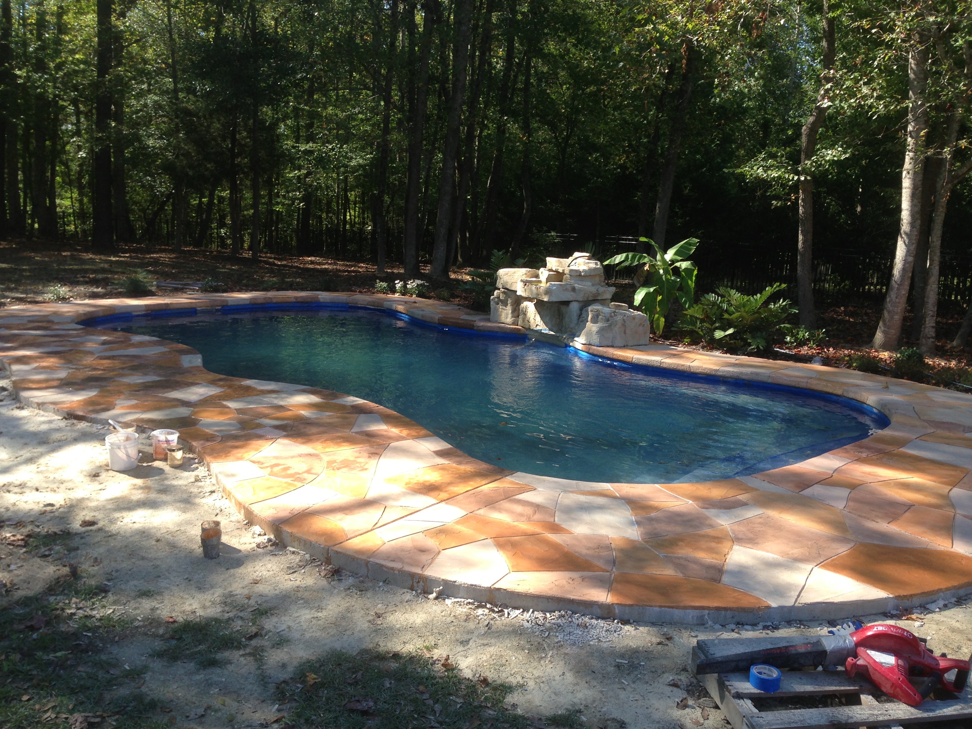 with Rico Rock Waterfall and Faux Stone Decking