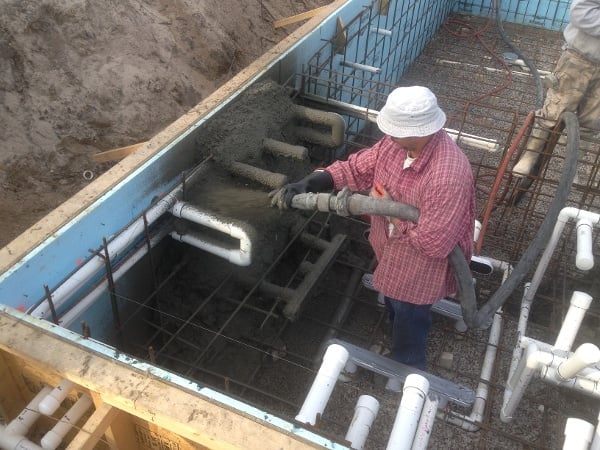 #4 steel rebar and plumbing is in place. Applying 4,000 PSI Concrete with Shotcrete Process
